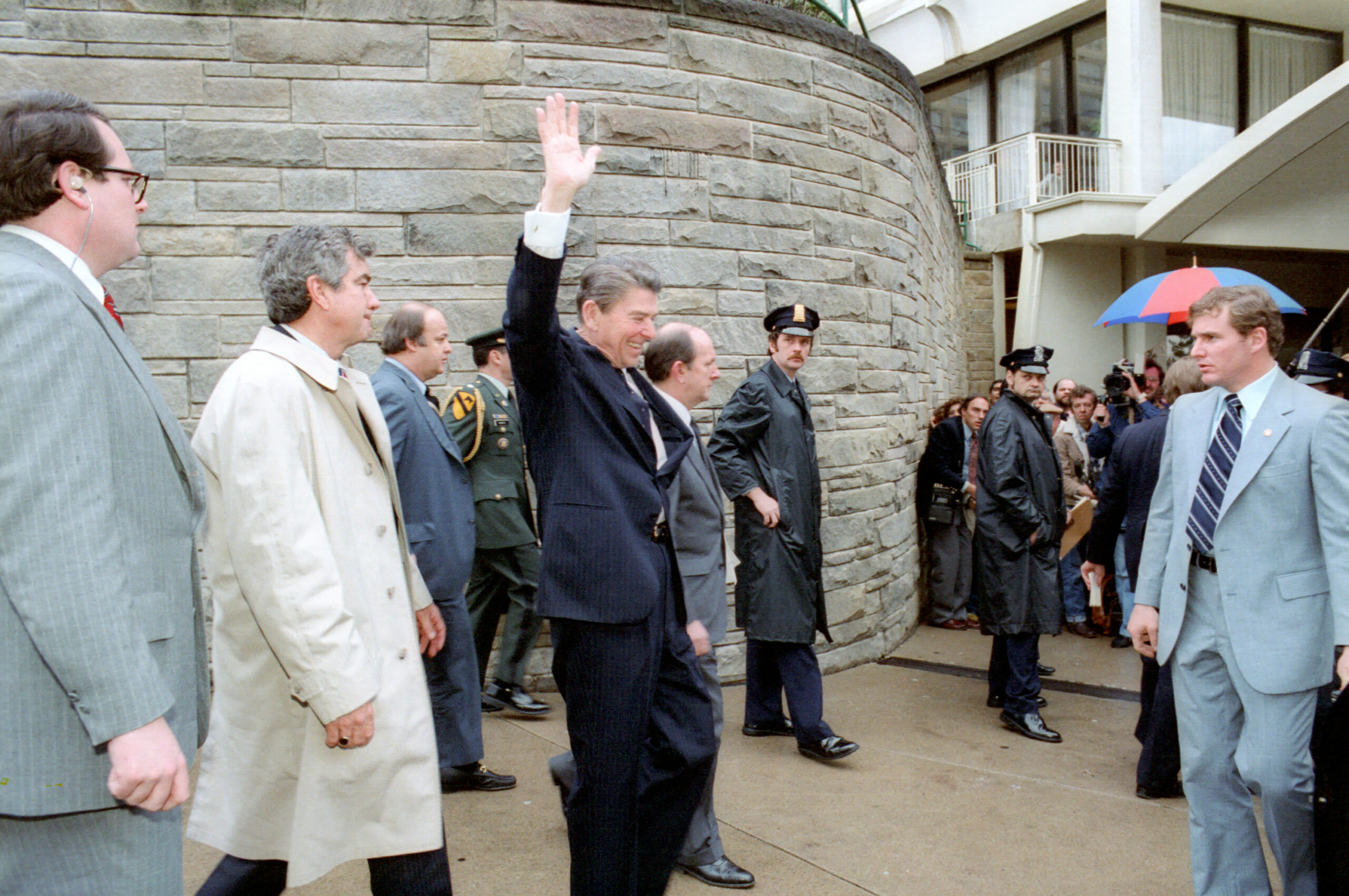 President Reagan waving to crowd moments before he is shot.