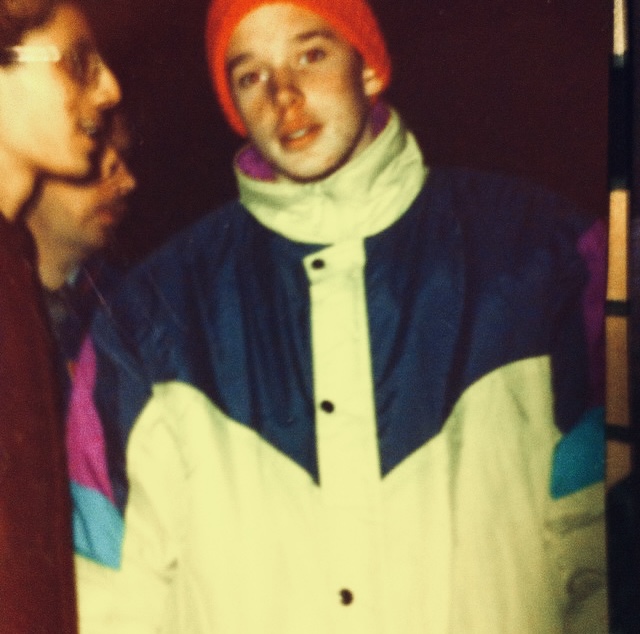 Jeremy Ritch as a teen wearing winter coat.