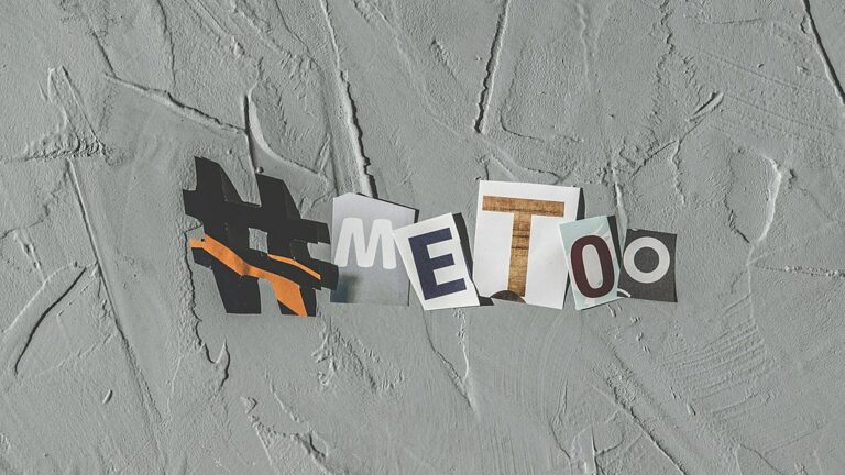 #metoo in block letters over grey background