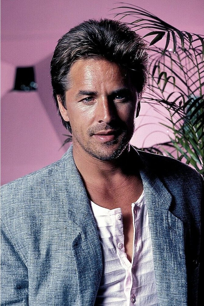 Don Johnson Portrait wearing a henley shirt and a sports coat