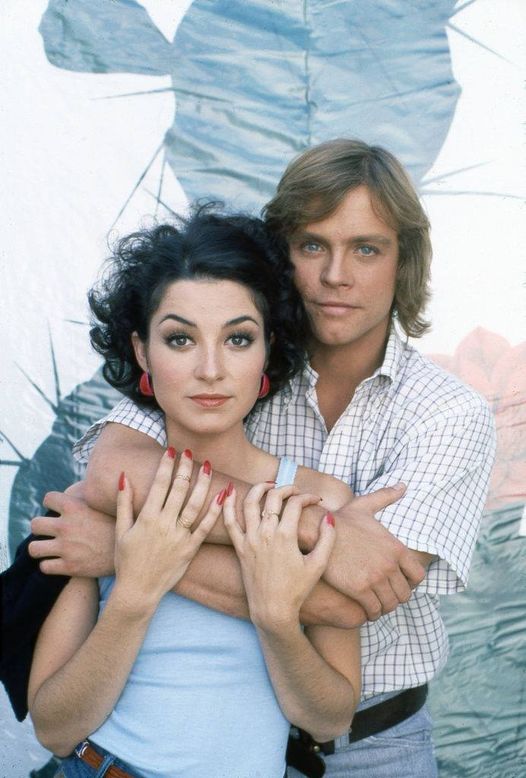 Mark Hamill holding Annie Potts in a promotional photo for the movie Corvette Summer in 1978