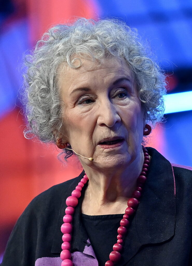 Margaret Atwood with grey curley hair and black top 