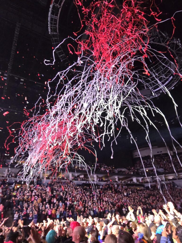 colorful paper above a large crowd