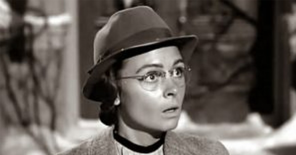 Mary as a Librarian with glasses on. 