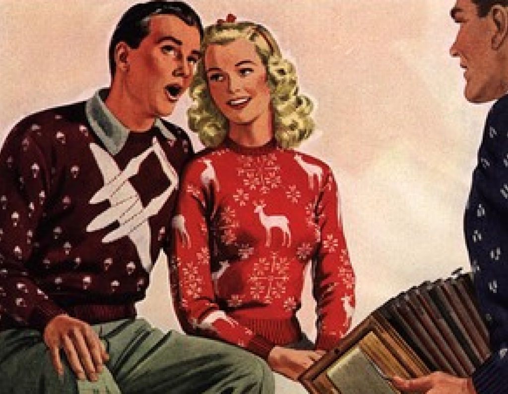 1950s ad features a woman and man wearing decorative christmas sweaters