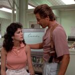 Gina and Crockett having a conversation in the breakroom.